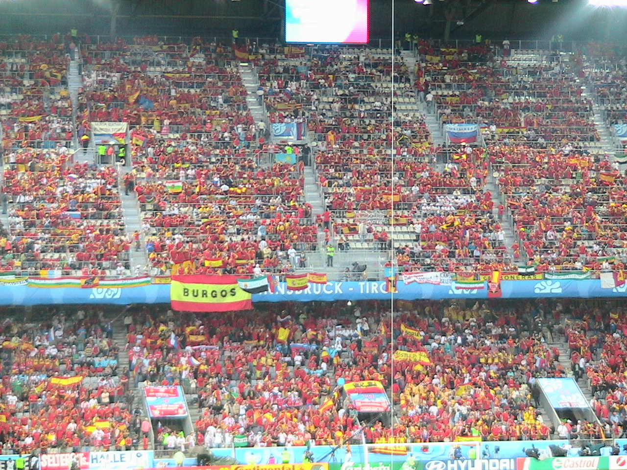 Spain football supporters in red and yellow